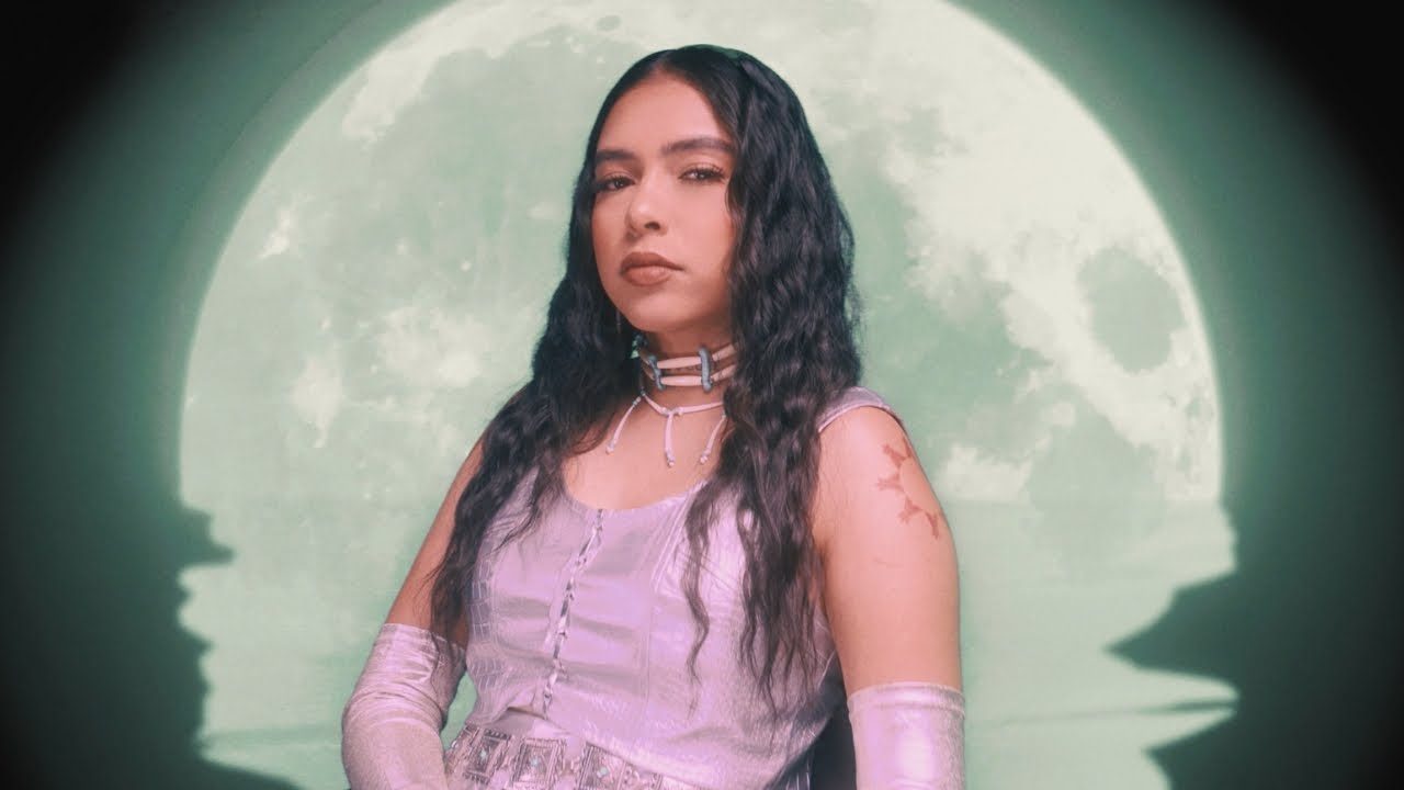 Still from the official music video for By My Side